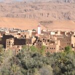 Panoramic view of Errachidia city with desert landscapes and palm oasis surroundings, Majesty Morocco Tours